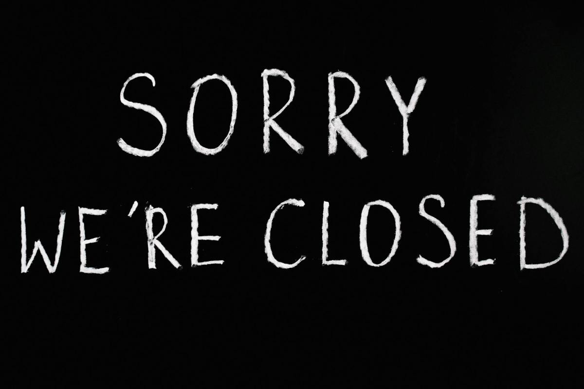 sorry we re closed lettering text on black background
