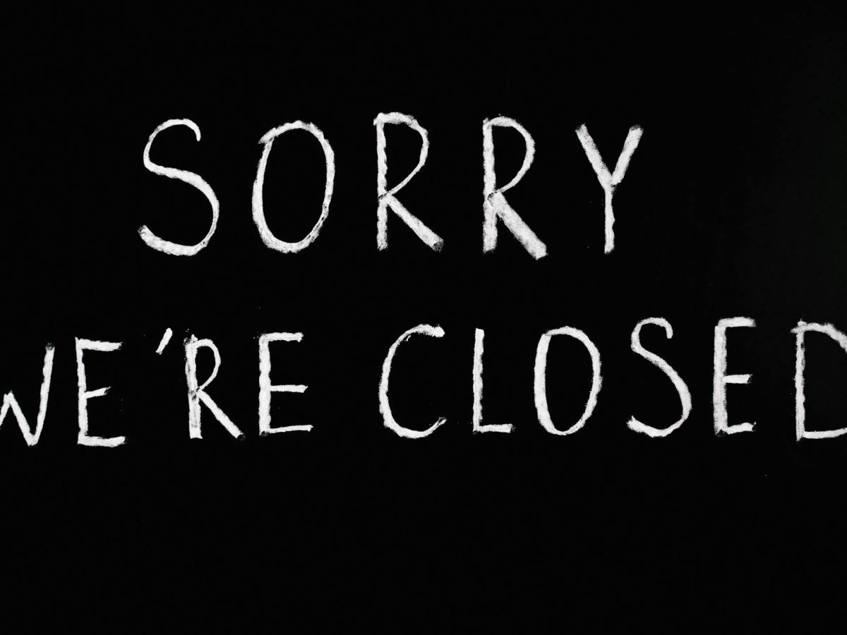 sorry we re closed lettering text on black background