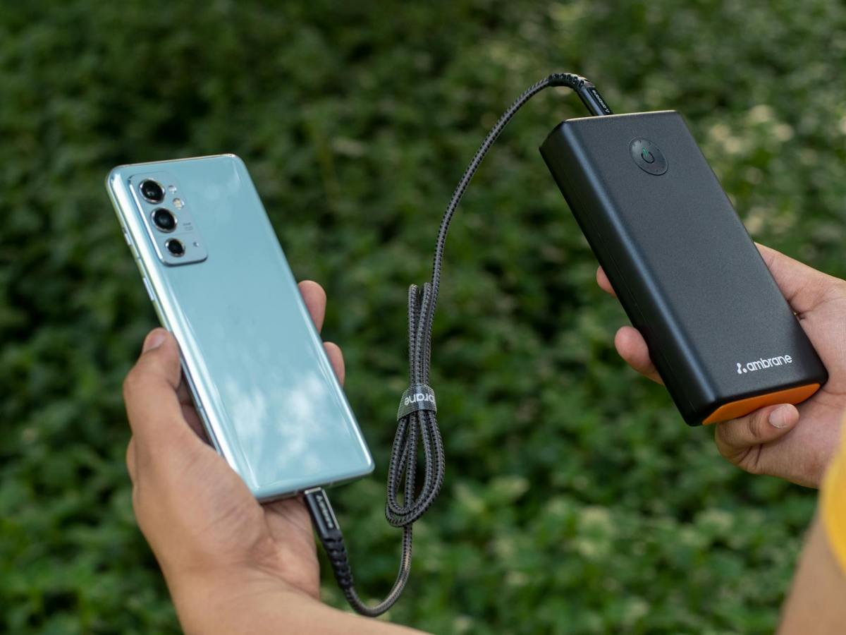 man charging cellphone with powerbank