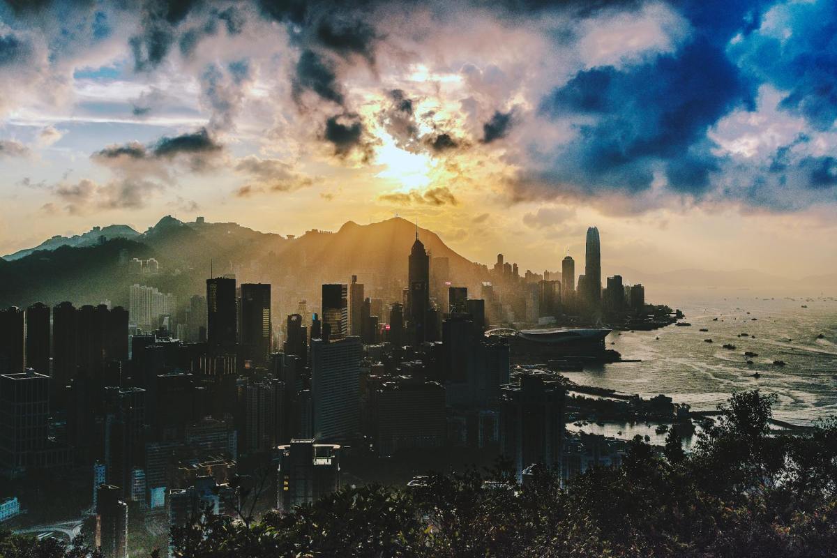 bird s eye view of city near ocean during sunset