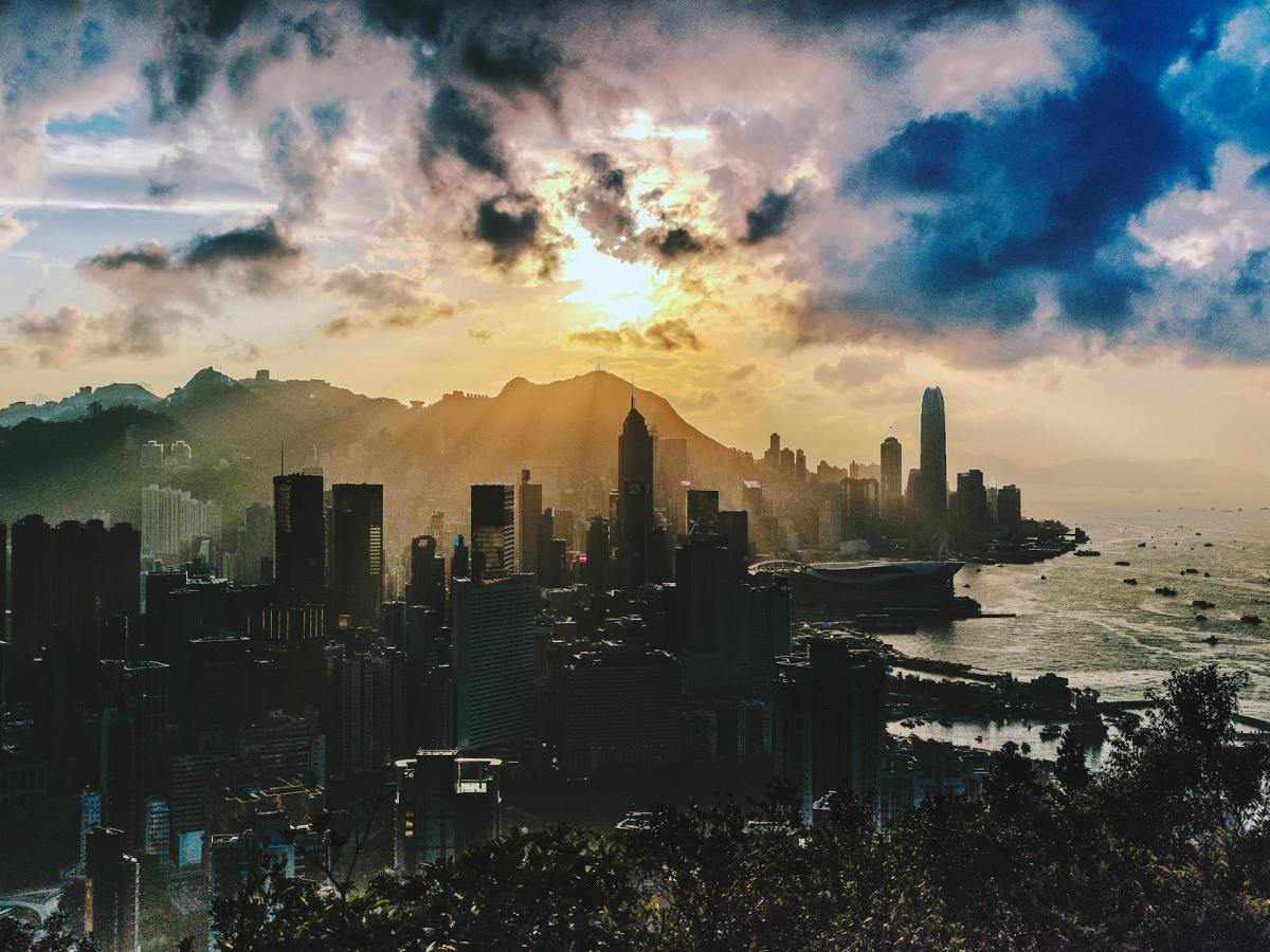bird s eye view of city near ocean during sunset