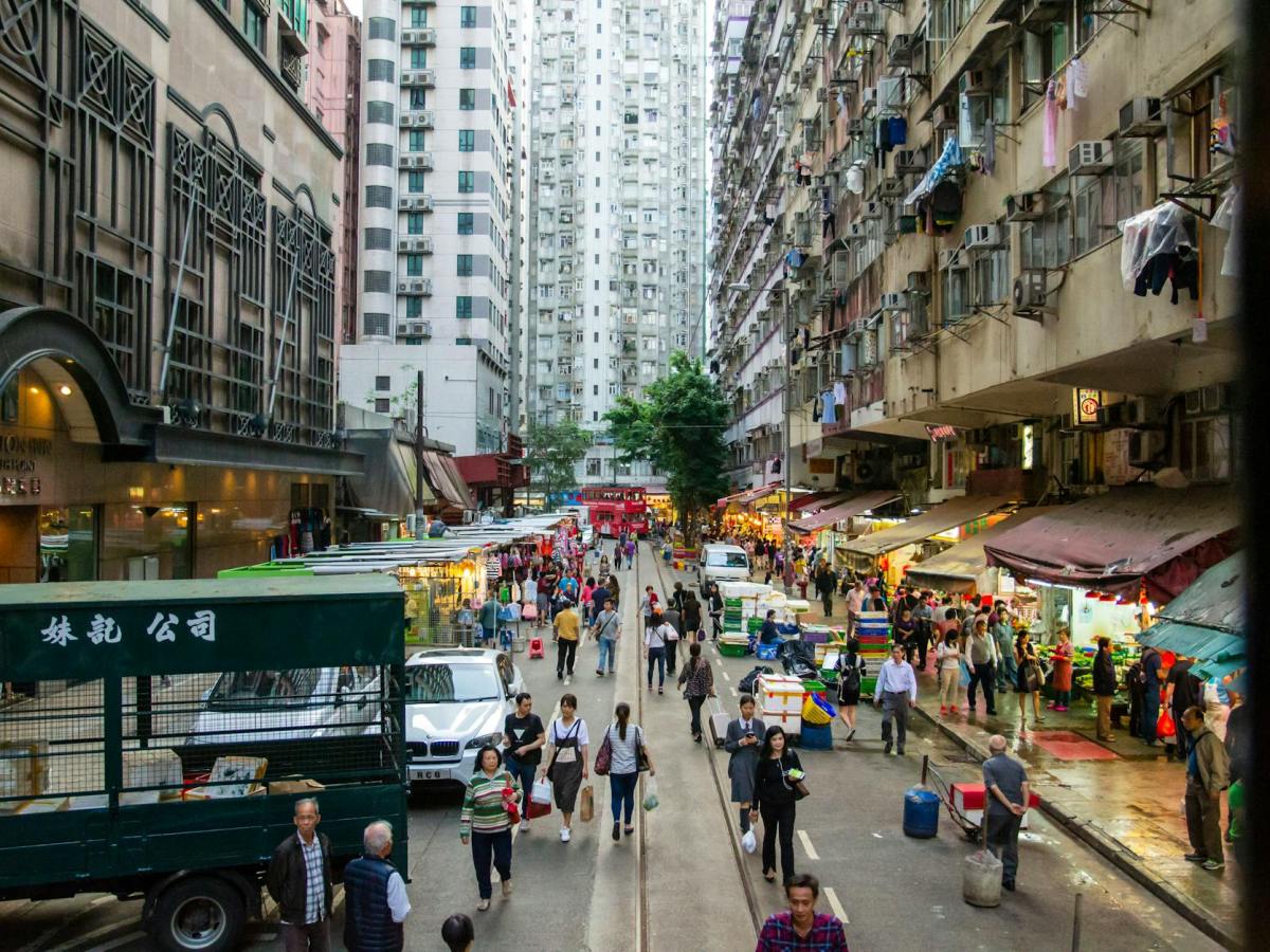 a street in the middle of a market hongkong
