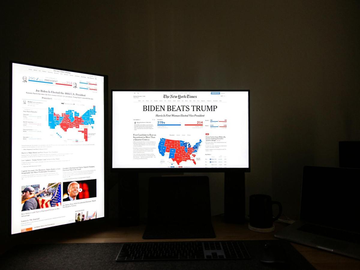 black flat screen computer monitor with headline news on display