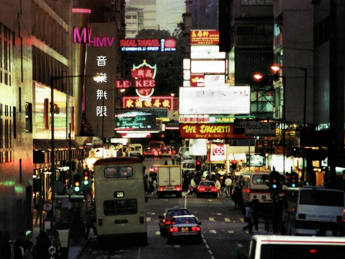 a busy street in hong kong at night
