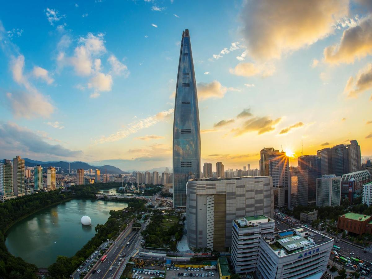 buildings and body of water during golden hour