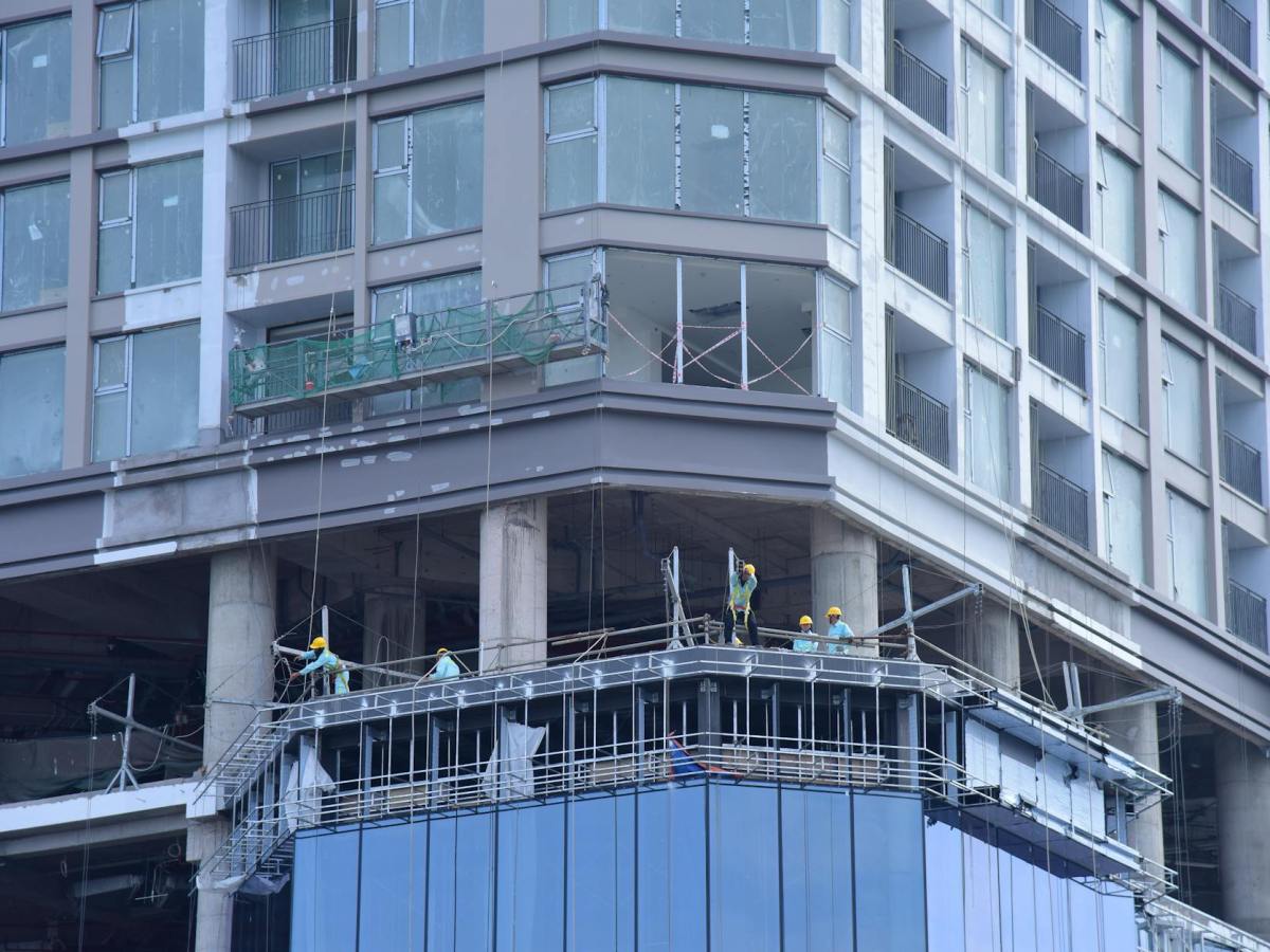 urban building construction site with workers