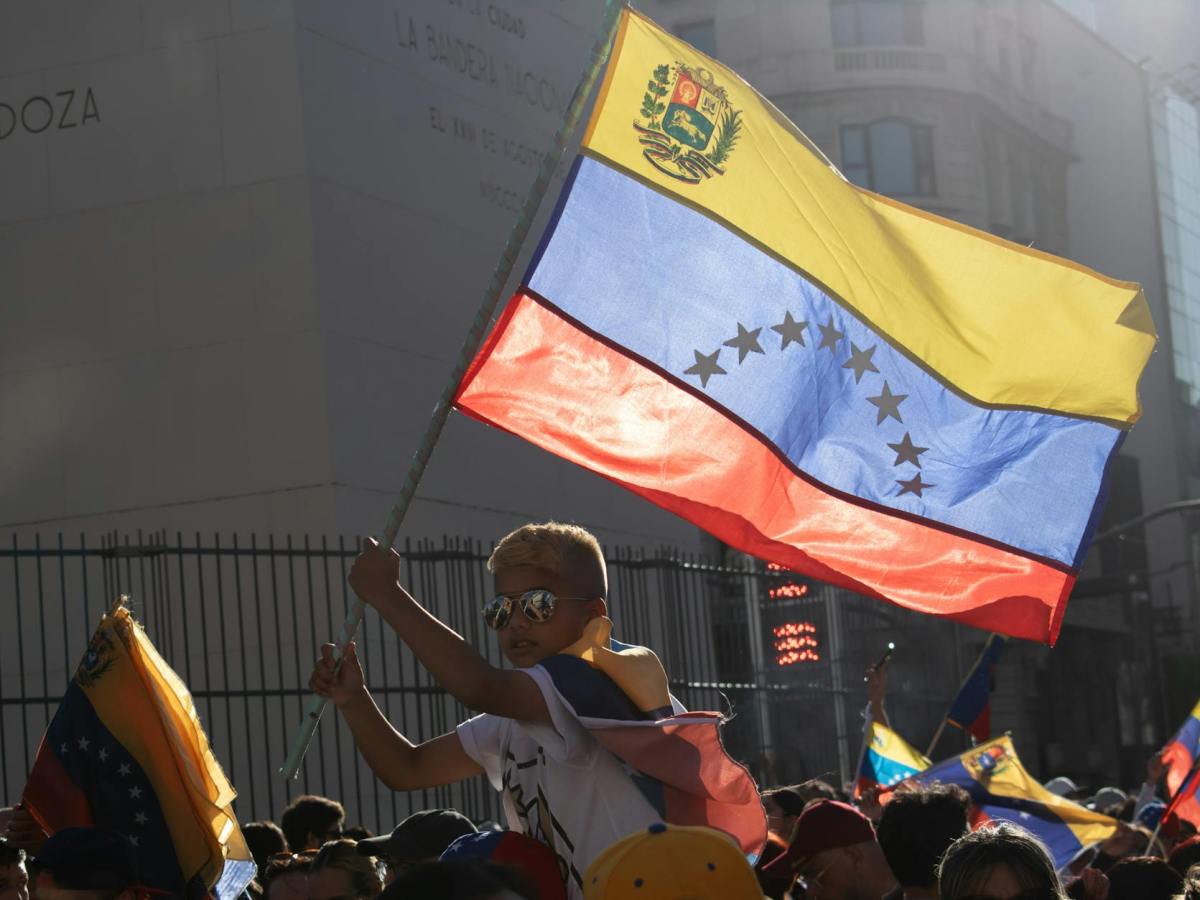 venezuelan protest with flag waving
