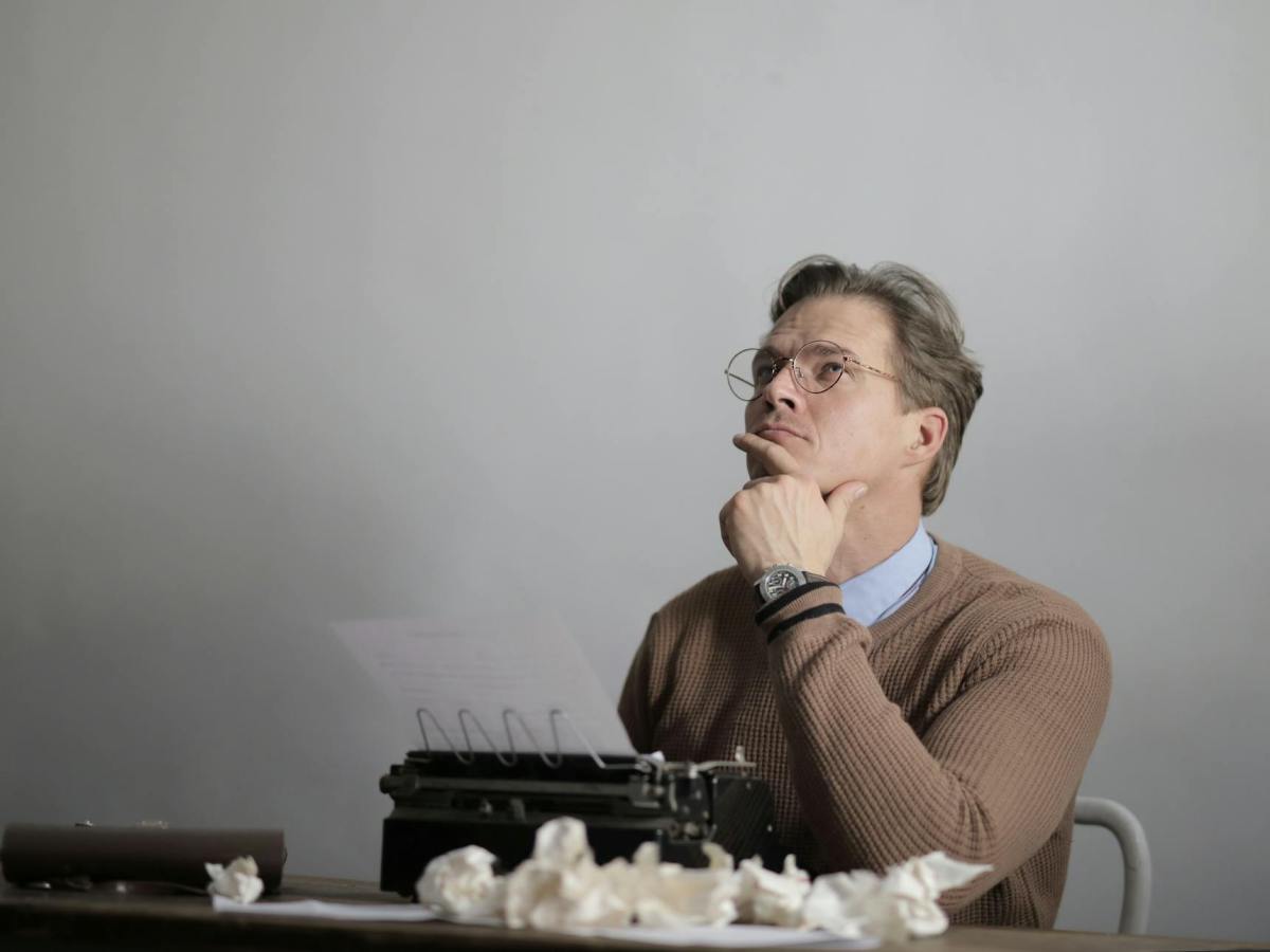 adult thoughtful writer creating new article