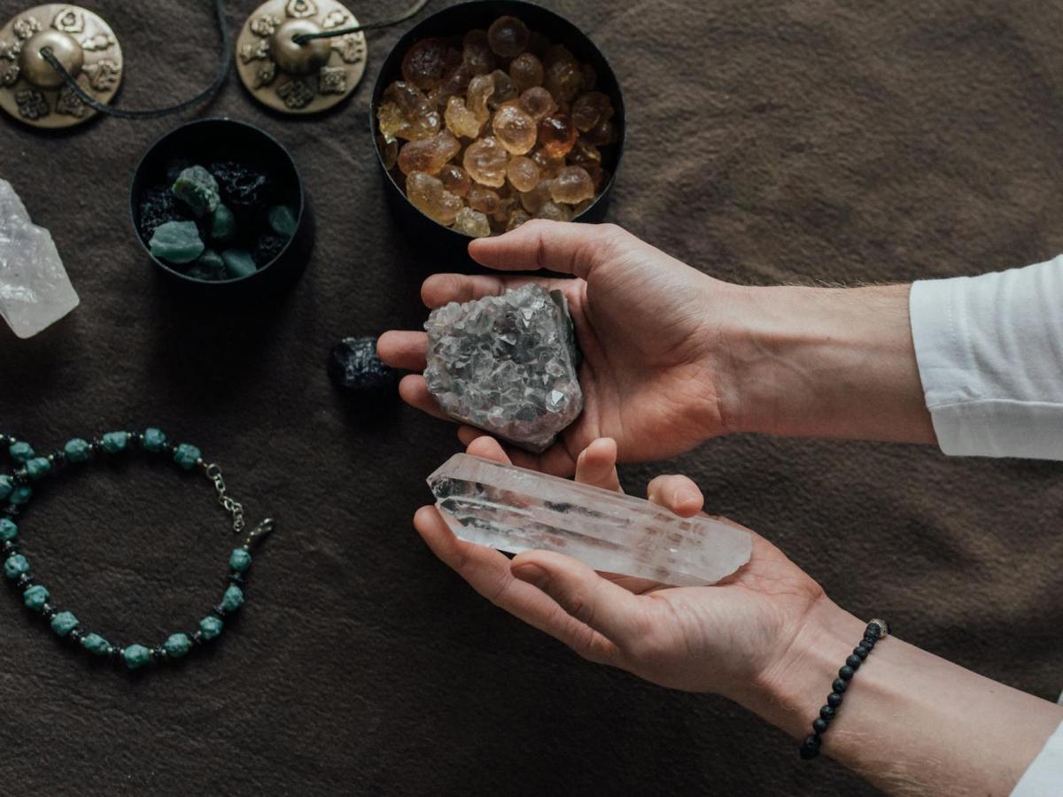 a person holding healing crystals