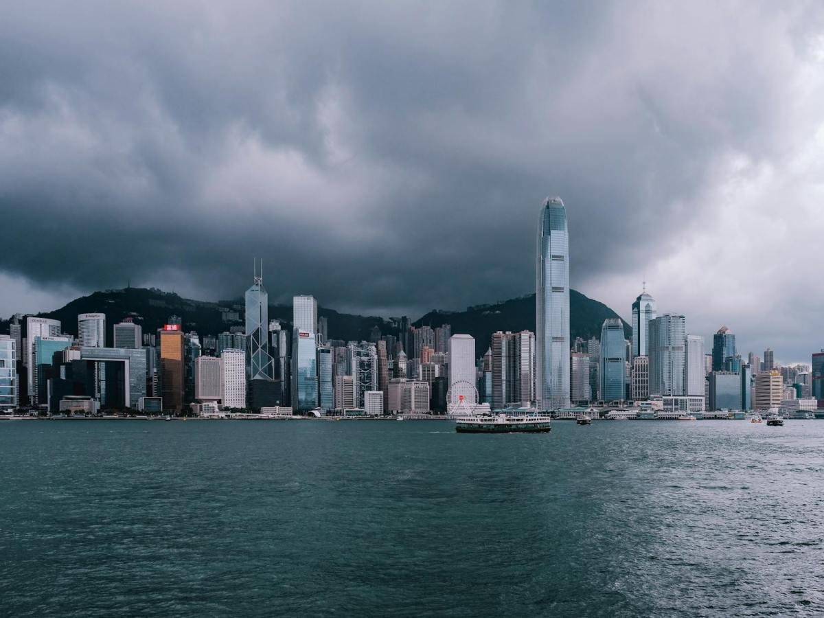 city buildings under the cloudy sky