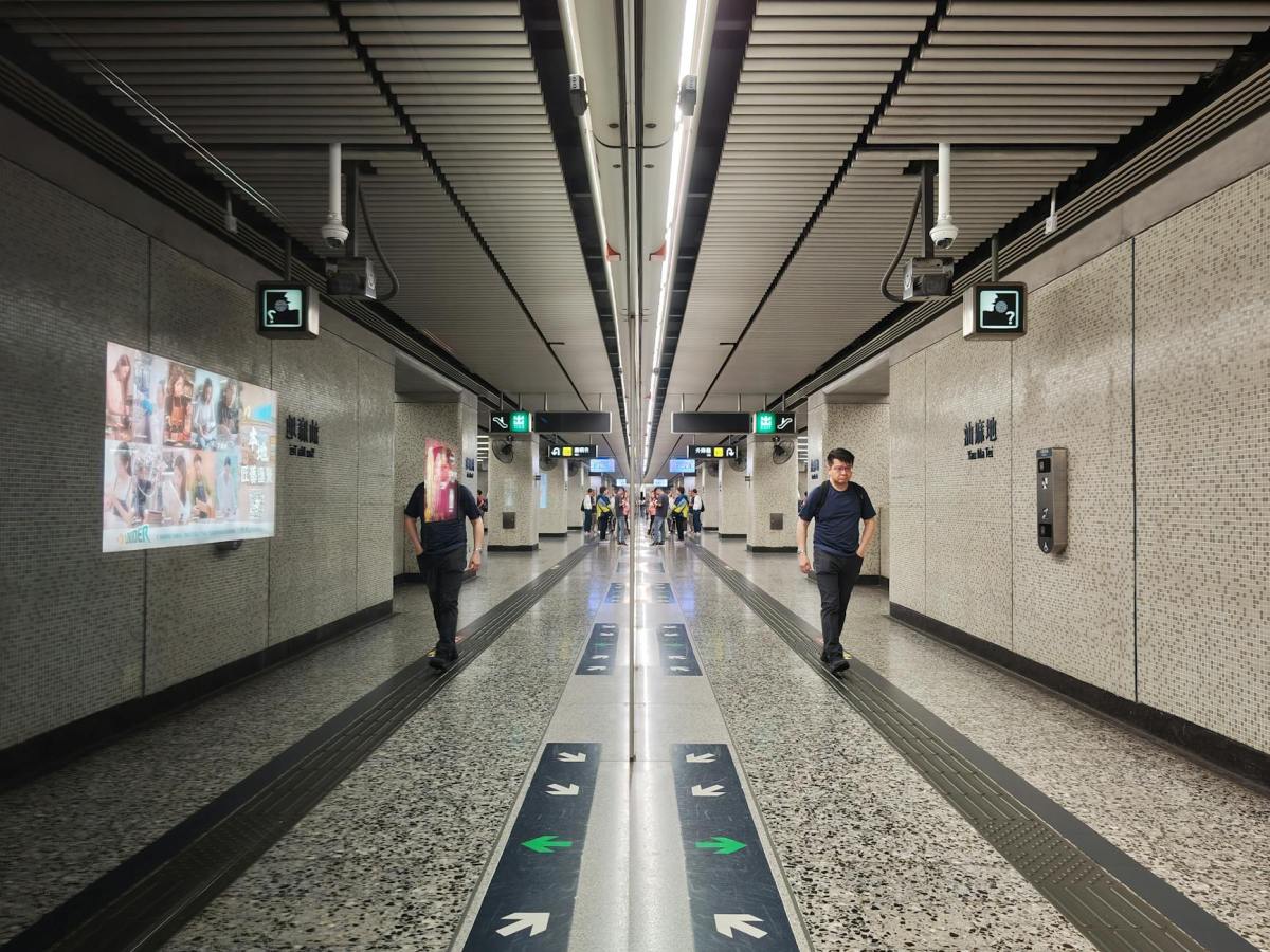 hong kong subway station interior with commuters