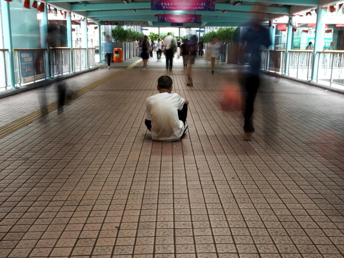 solitude in a busy hong kong walkway