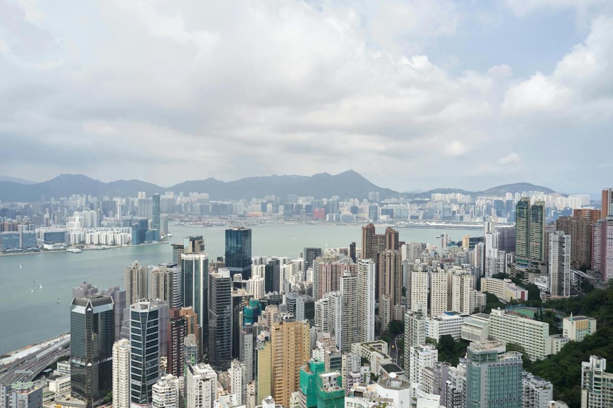 city skyline under white cloudy sky
