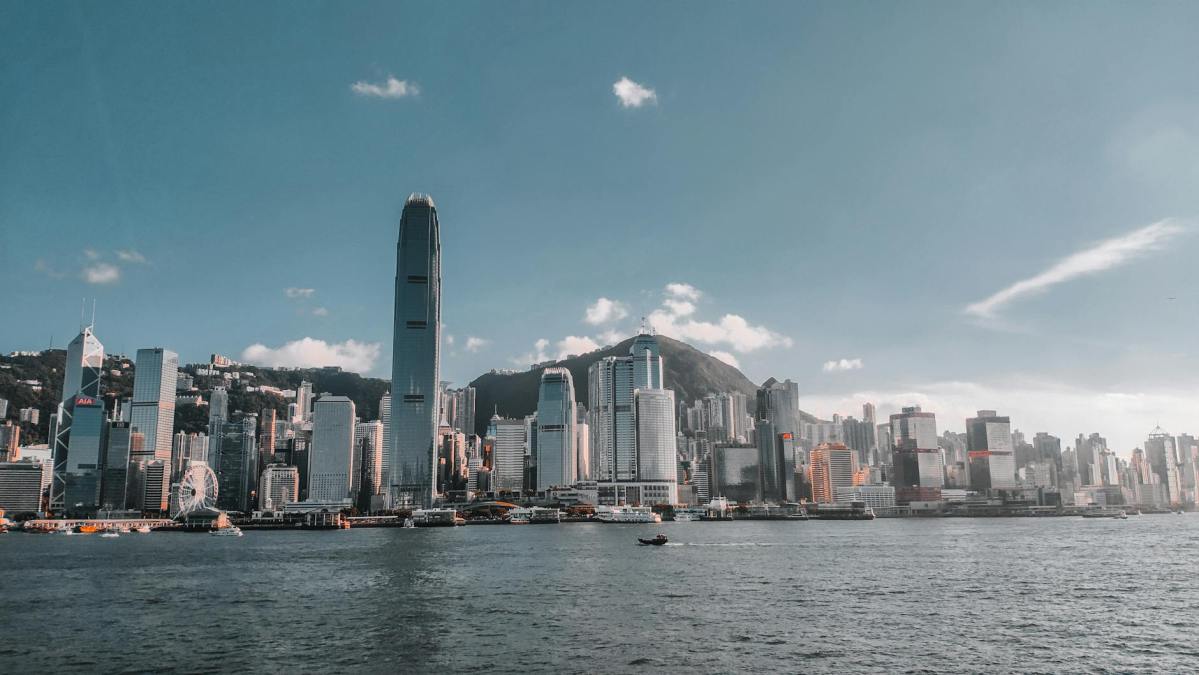the famous skyscrapers of hong kong with a view from across a river
