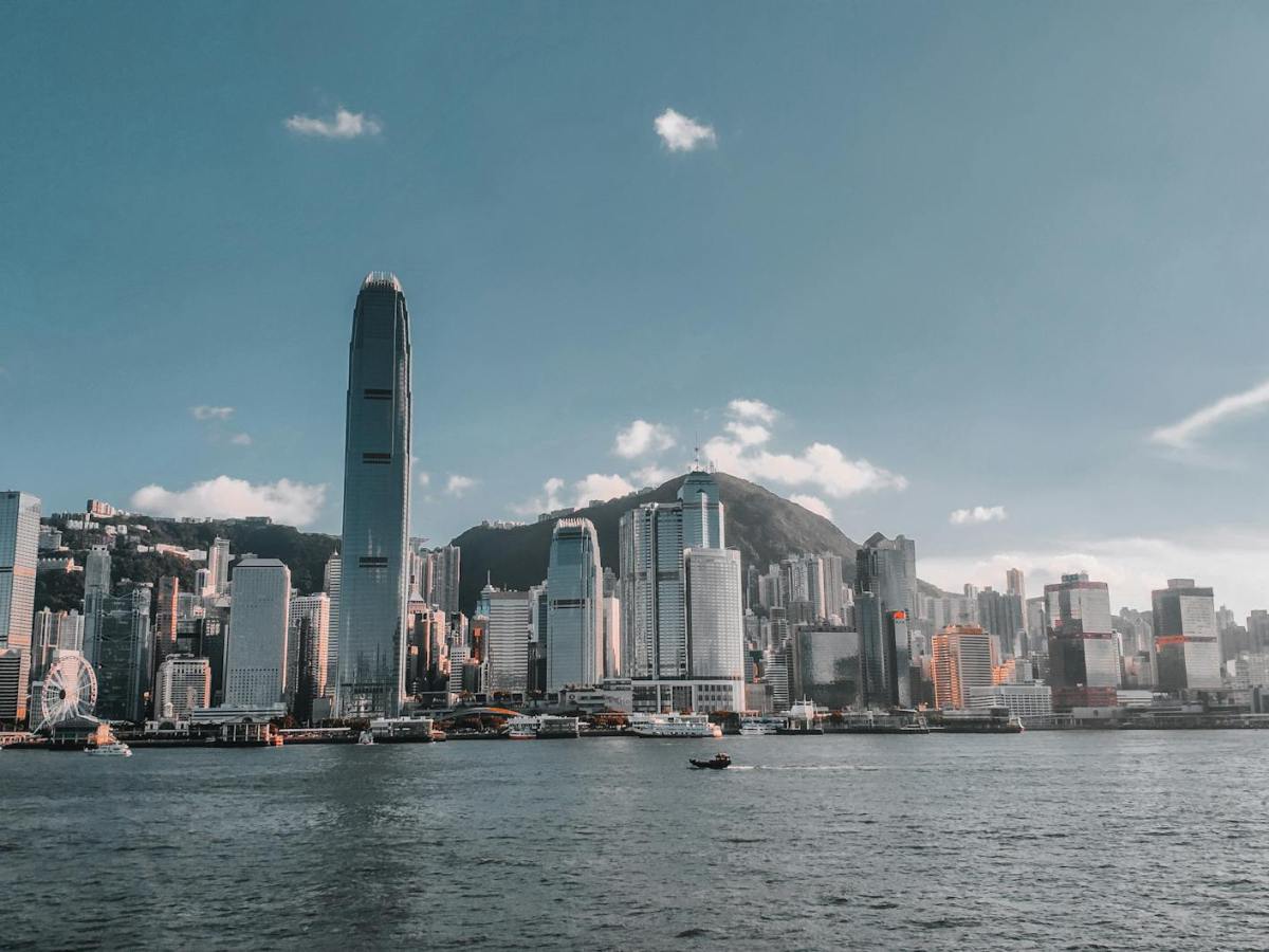 the famous skyscrapers of hong kong with a view from across a river