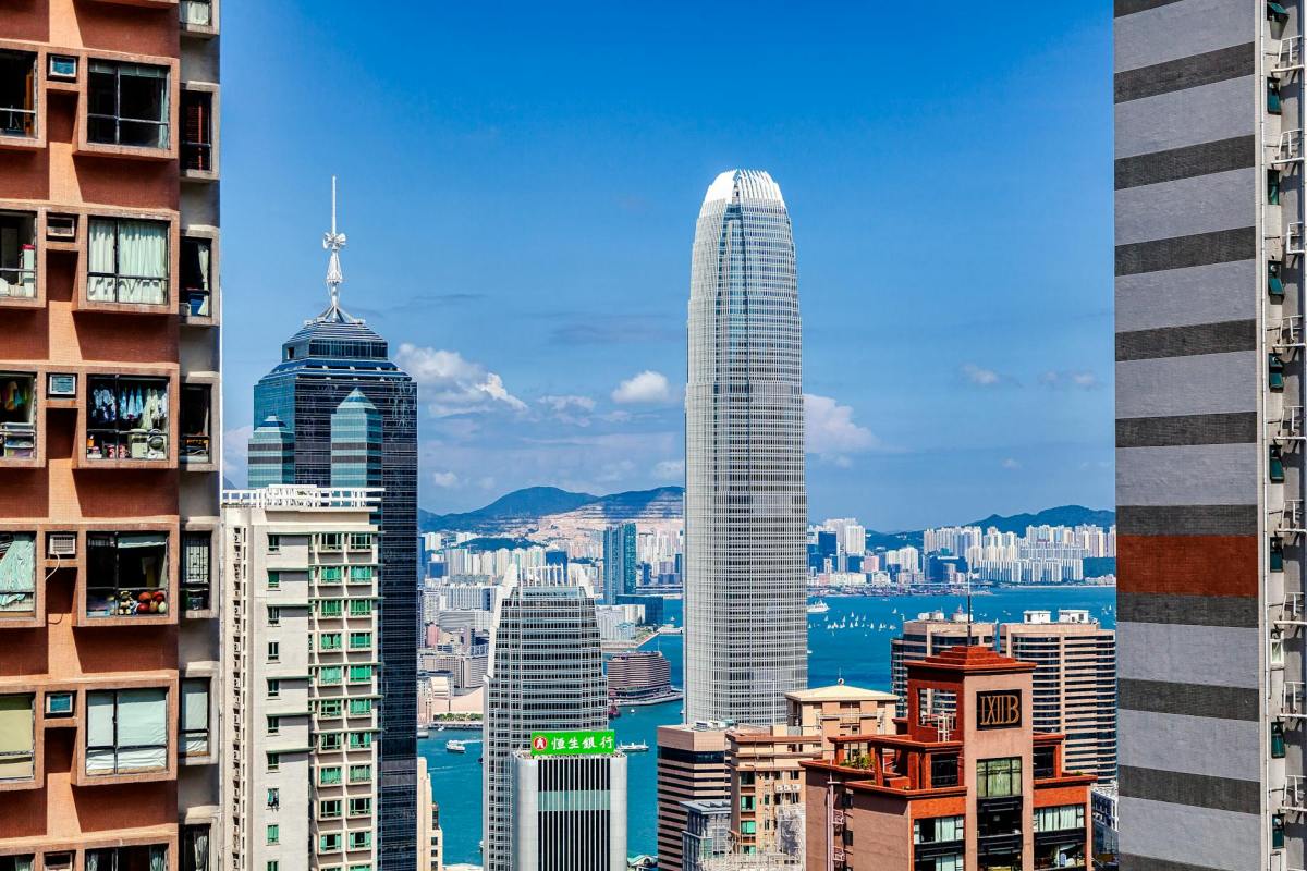 city buildings under the blue sky