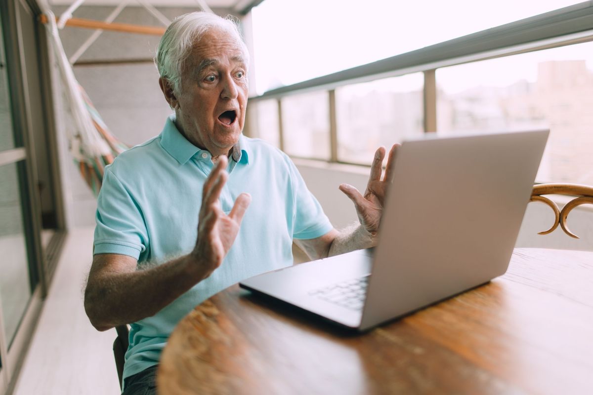 elderly man with laptop