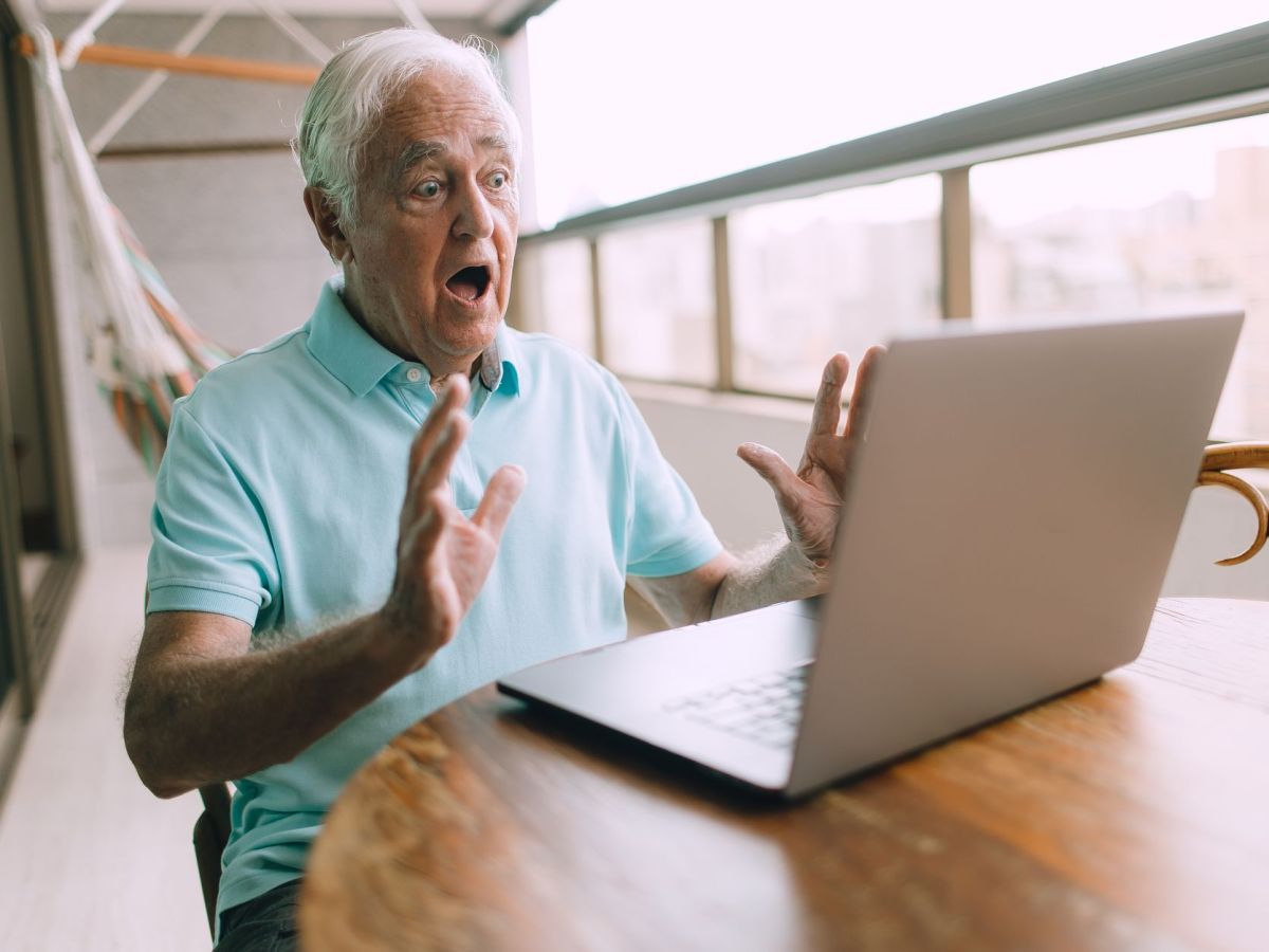 elderly man with laptop