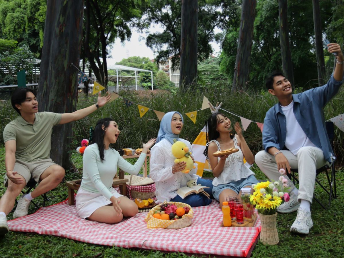 friends enjoying picnic in a lush park setting