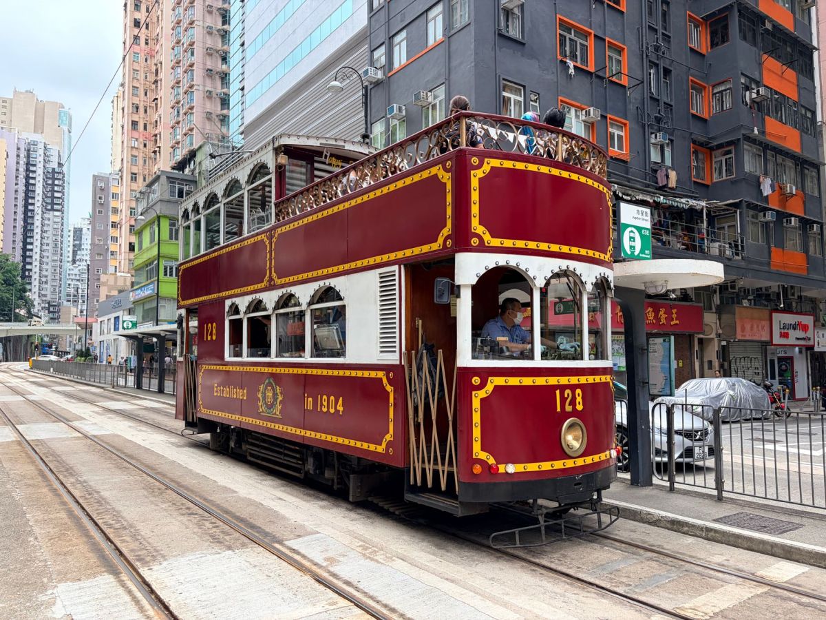 vintage hong kong tram on urban street scene