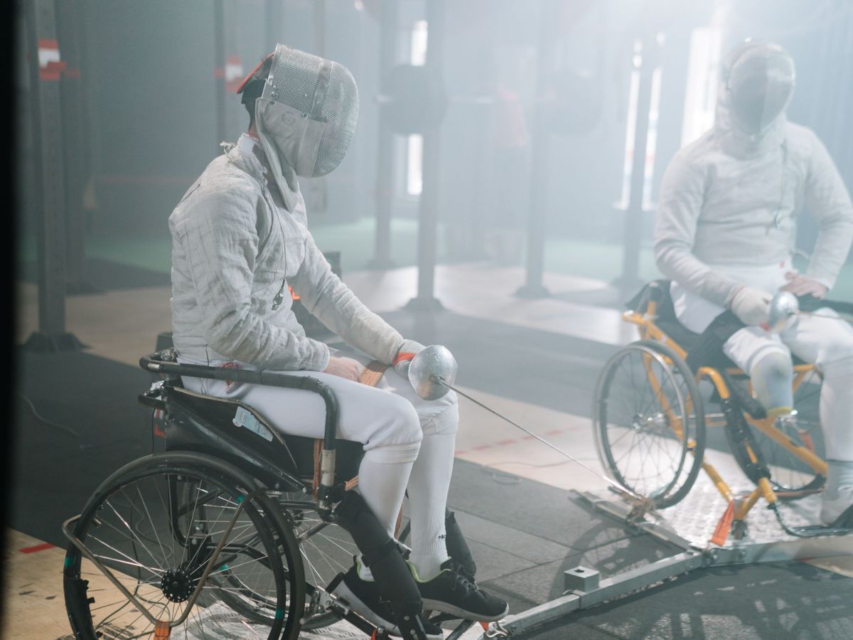 paralympic foilers in fencing masks