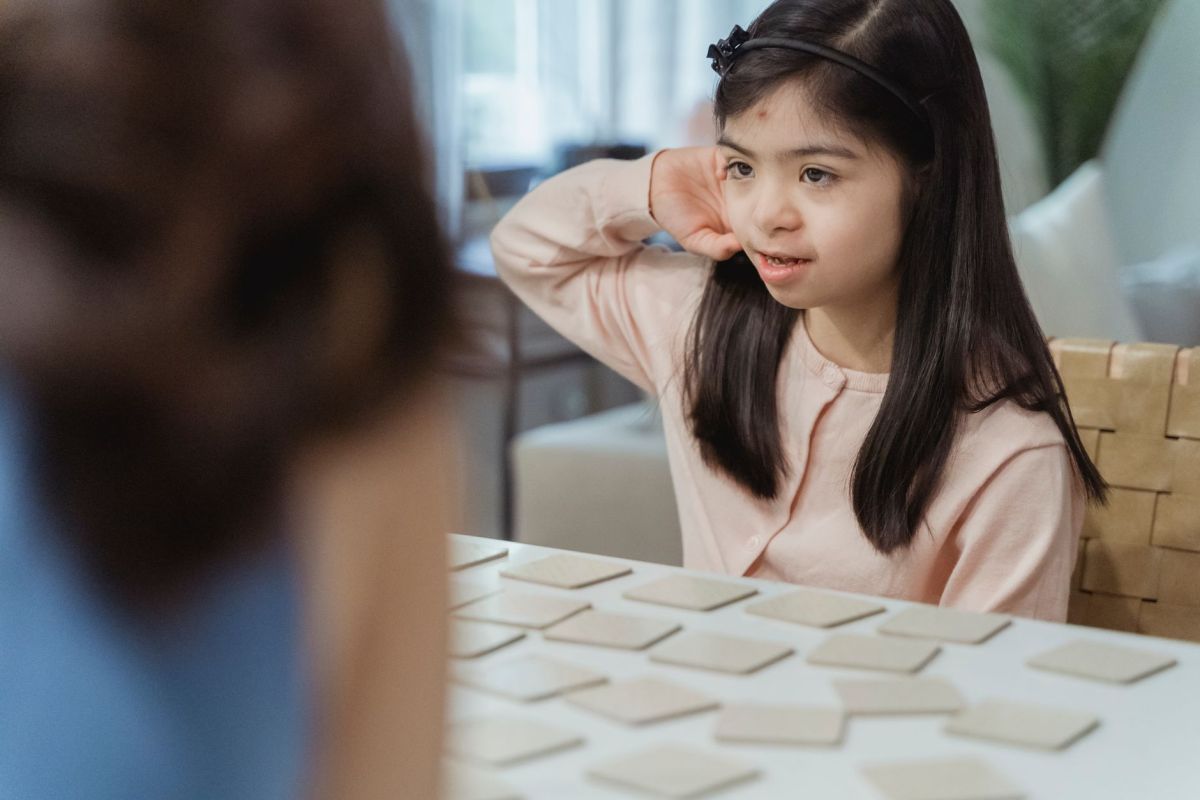 little girl playing memory game