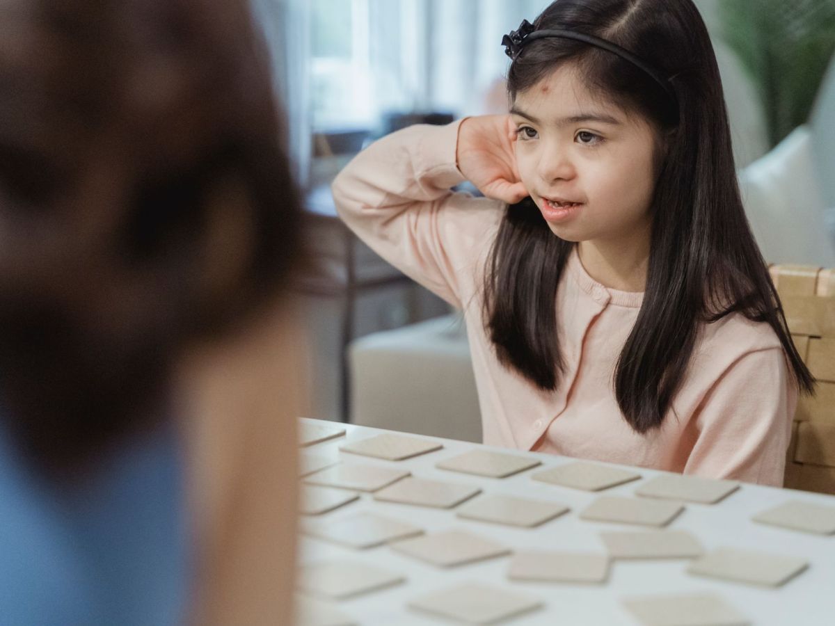 little girl playing memory game