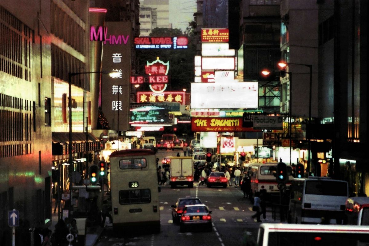 a busy street in hong kong at night