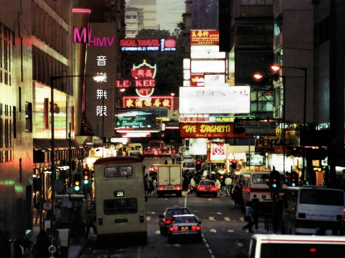 a busy street in hong kong at night
