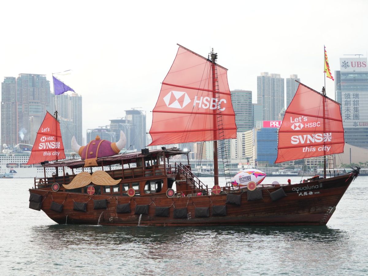 hong kong junk boat with red sails on victoria harbour